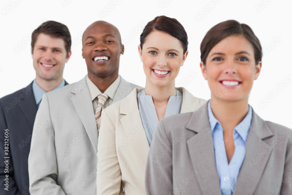 Smiling young tradesteam standing together Smiling young tradesteam standing together