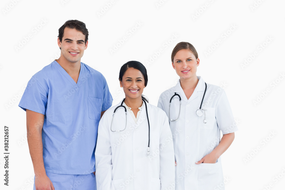 Smiling medical staff standing together Smiling medical staff standing together