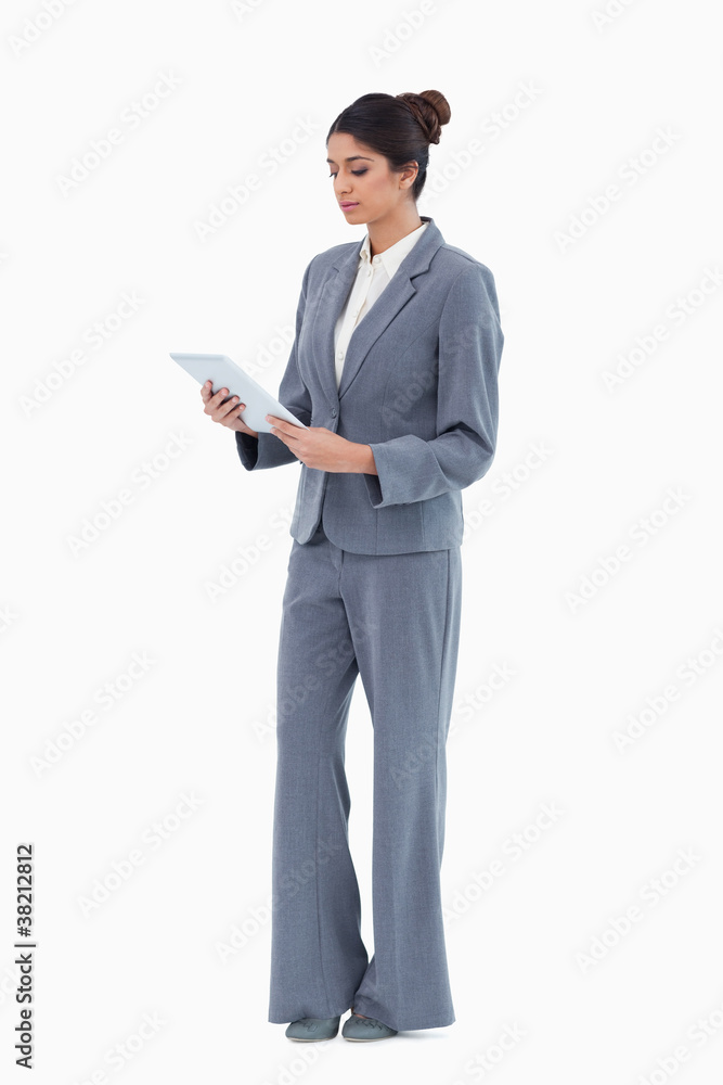 Businesswoman looking at tablet