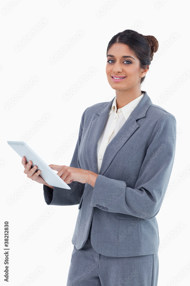 Smiling saleswoman using tablet computer Smiling saleswoman using tablet computer