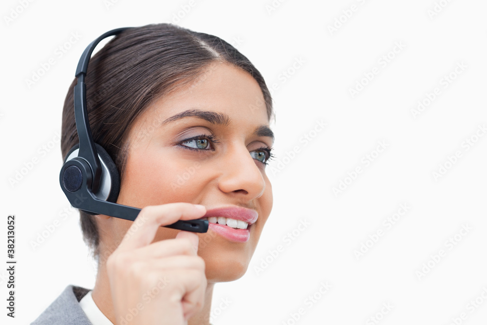 Side view of female call center agent with headset Side view of female call center agent with headset