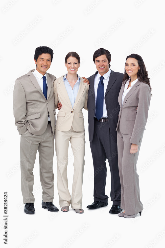 Smiling young salespeople standing together Smiling young salespeople standing together