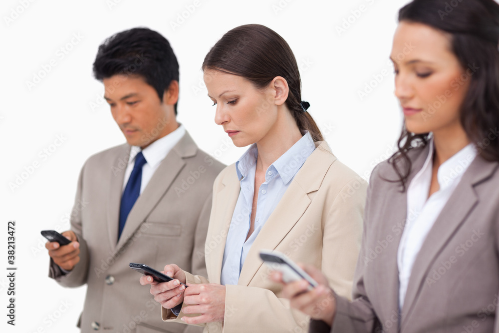 Salesteam looking at their cellphones