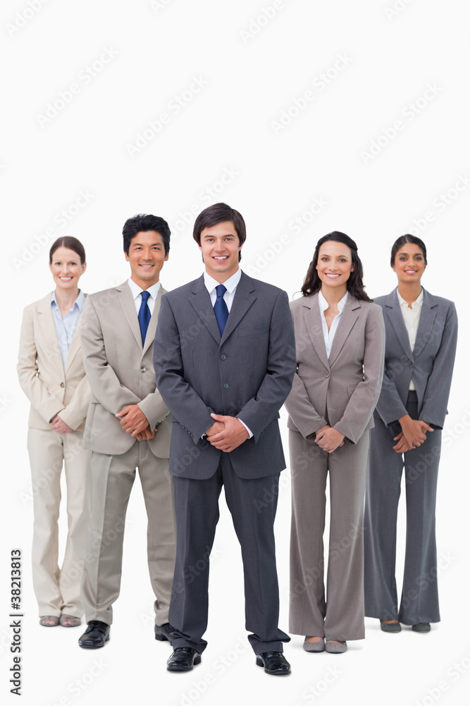Smiling businessman standing with his team Smiling businessman standing with his team