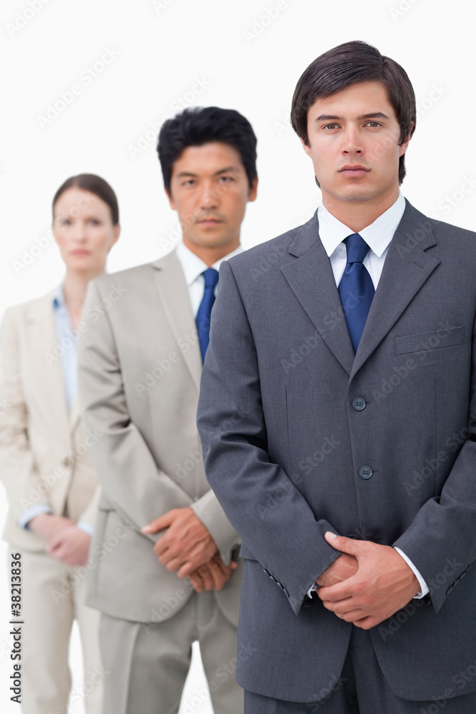 Young salesteam standing in line Young salesteam standing in line