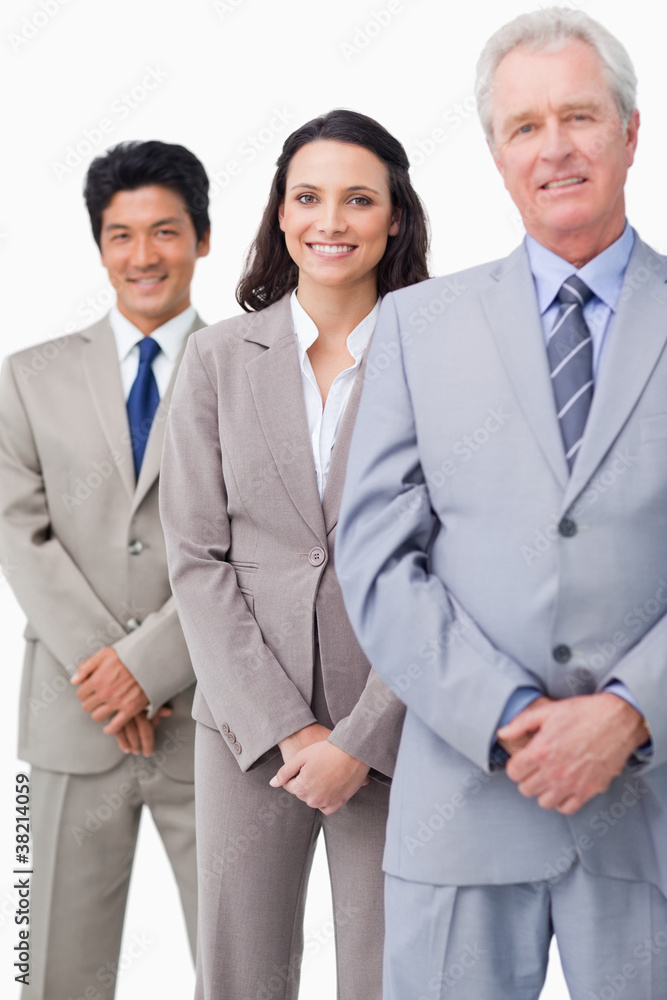Young employees standing behind their boss