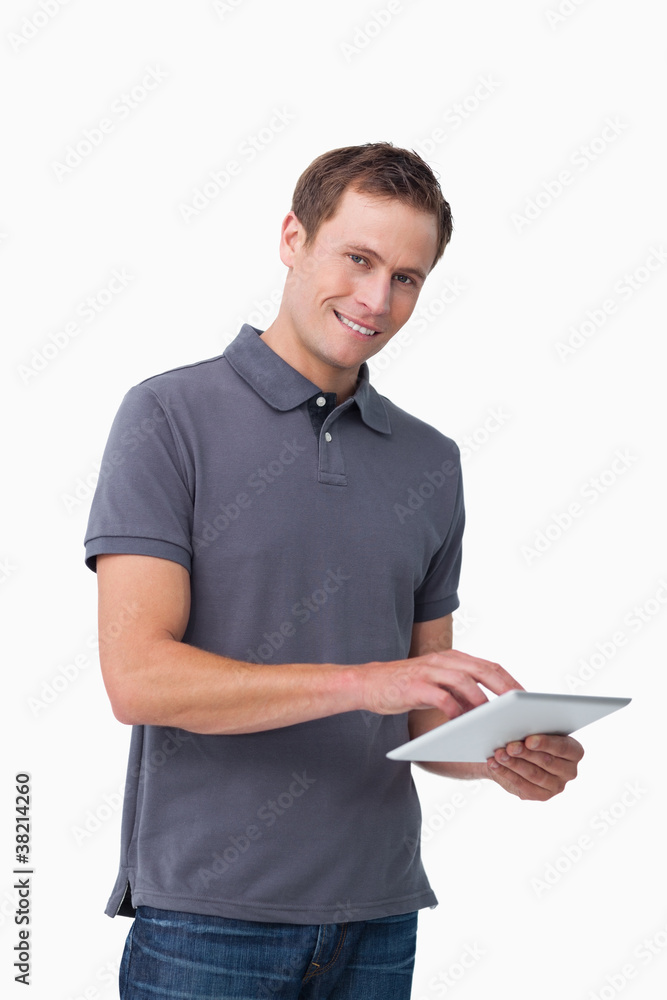 Smiling young man with tablet computer Smiling young man with tablet computer