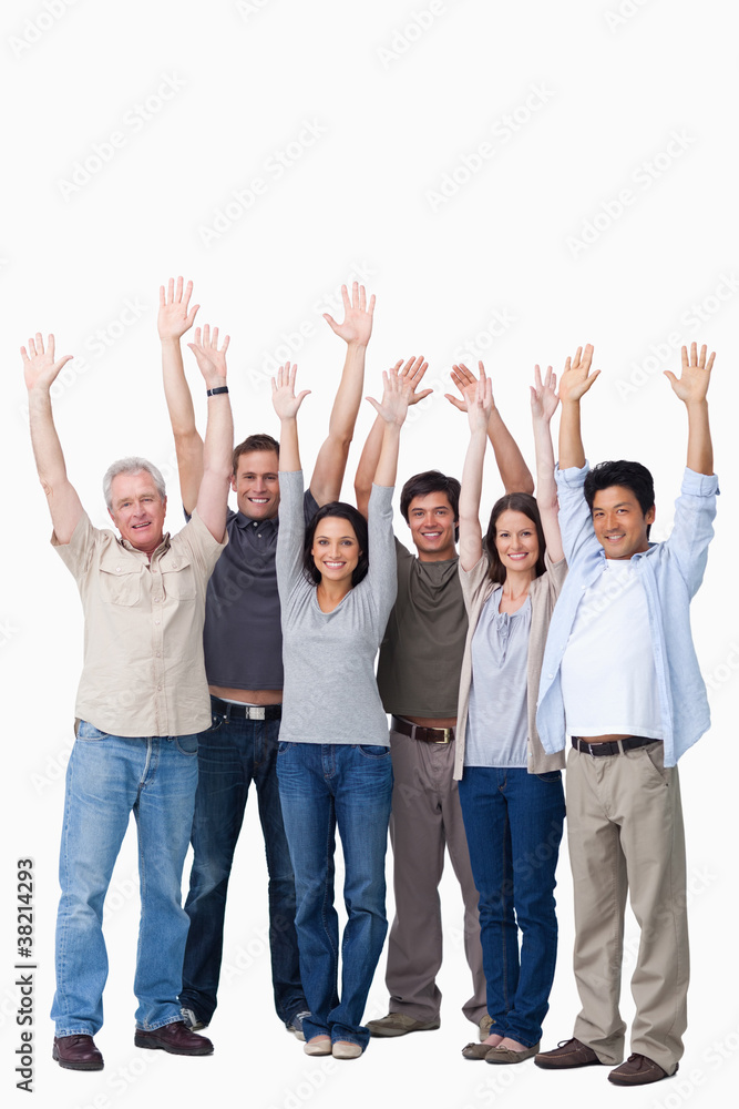 Cheering group of friends raising their arms Cheering group of friends raising their arms