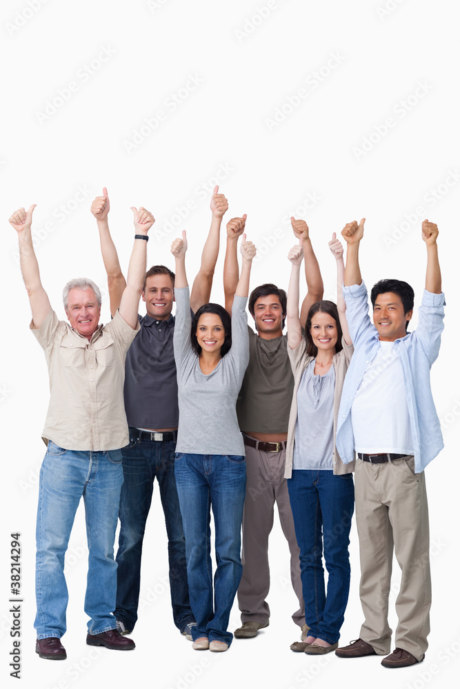Smiling group of friends giving thumbs up Smiling group of friends giving thumbs up