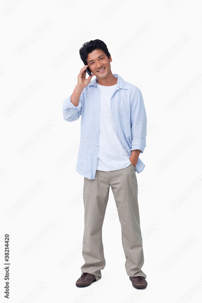 Smiling male on cellphone Smiling male on cellphone