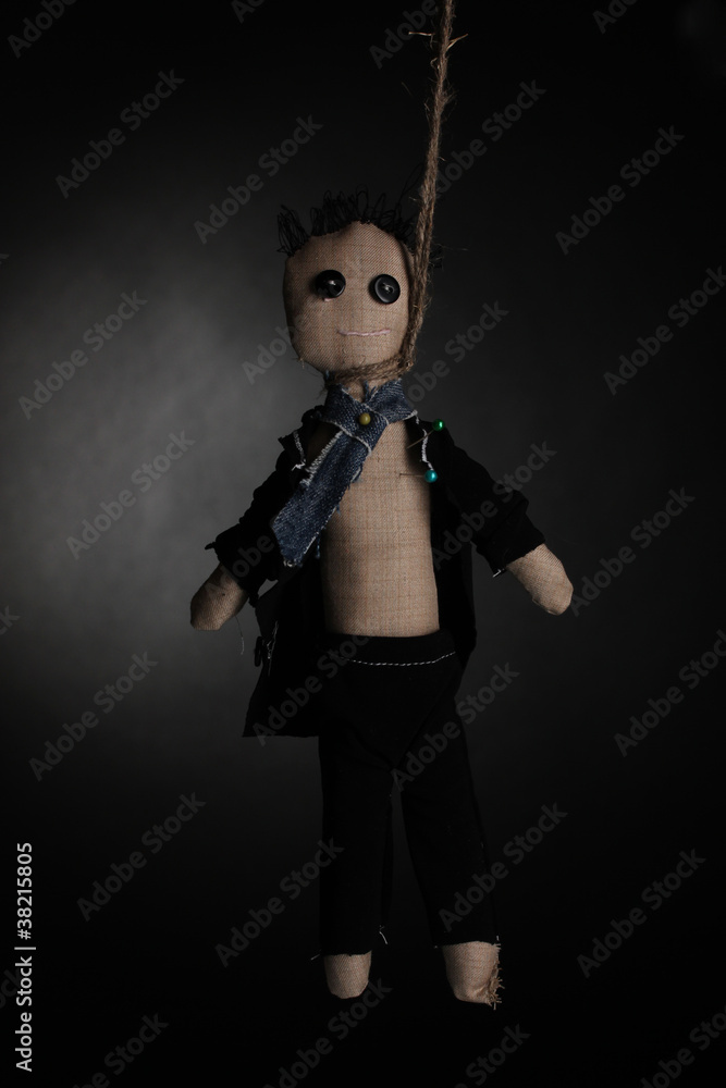 Obraz premium Hanged doll voodoo boy-groom on grey background