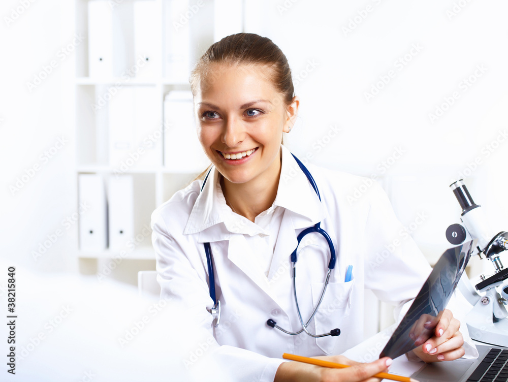Friendly doctor in medical office Friendly doctor in medical office