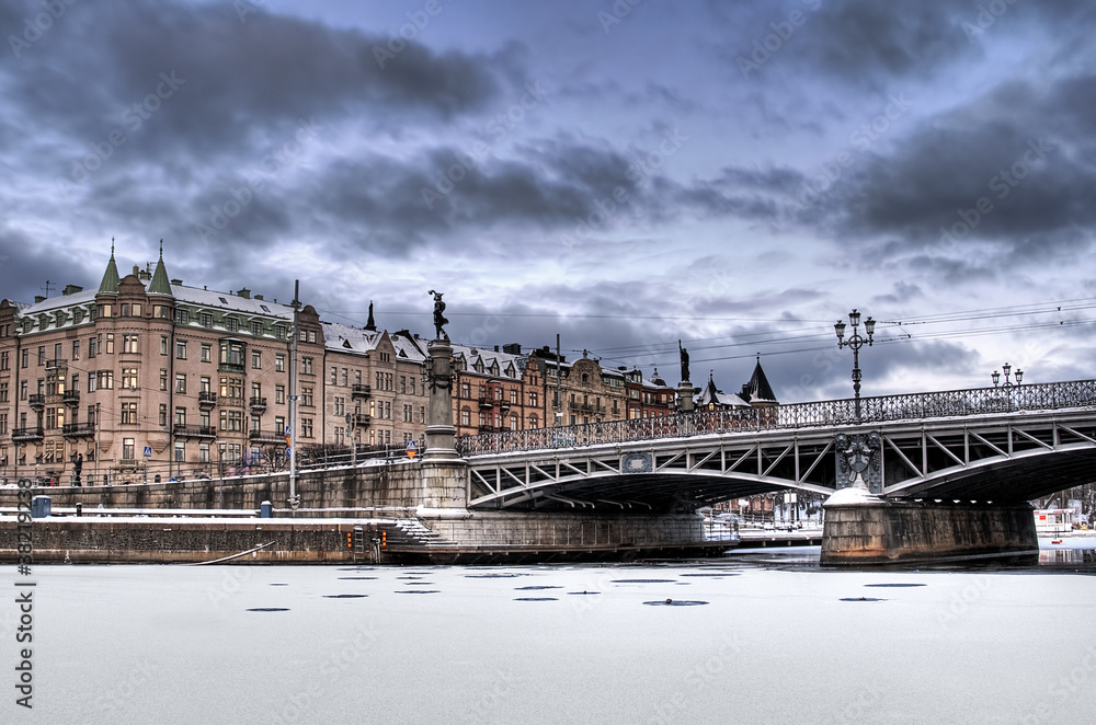 Old buildings and bridge in winter.
