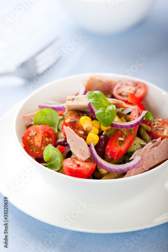 Bowl of mixed vegetable salad with tuna
