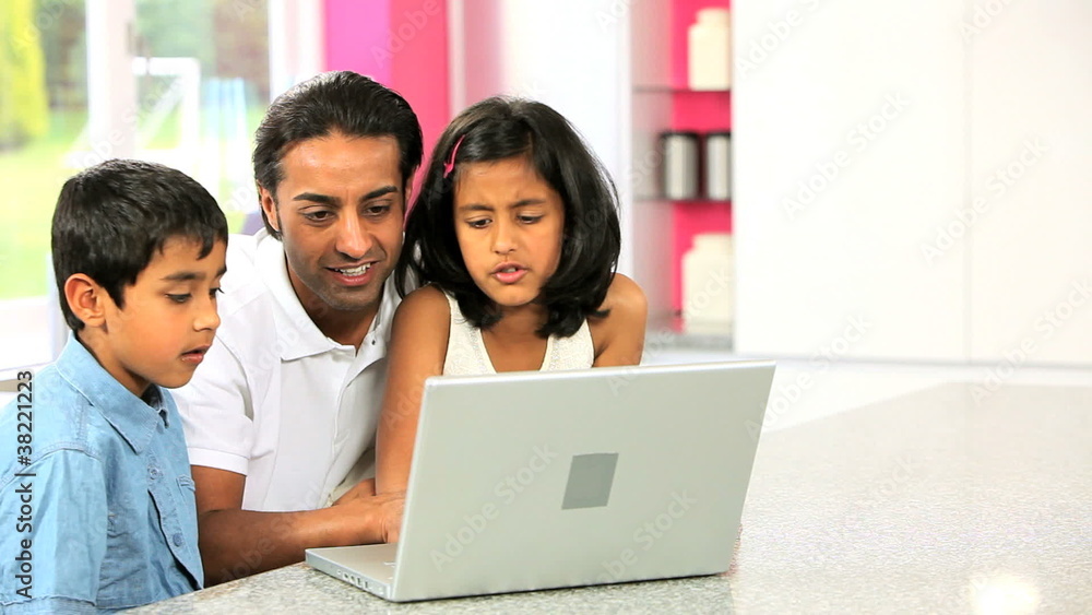 Young Asian Father & Children Using Laptop Young Asian Father & Children Using Laptop