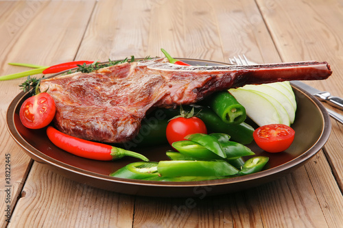 meat food : grilled beef spare rib on dark dish photo