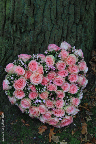 Pink sympathy flowers in heart shape