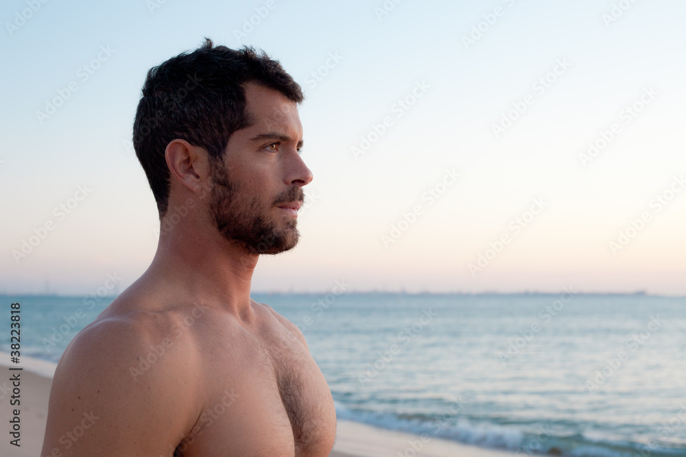 Handsome muscular man on the beach. Handsome muscular man on the beach.