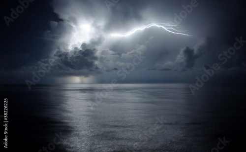 Lightning in a cloud over ocean #38226225