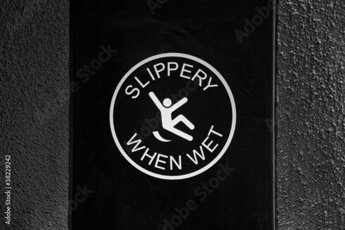 slippery when wet - warning sign photo