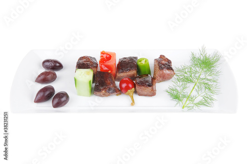 eef meat goulash over white plate isolated on white background photo