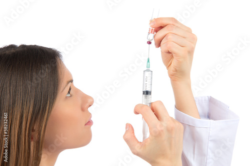 nurse woman with medical syringe with needle