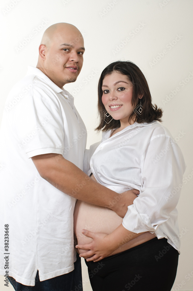 Cute latin american pregnant couple