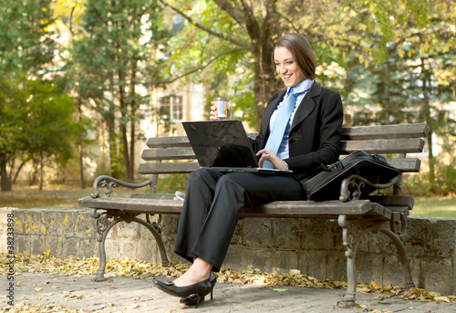 smiling businesswoman with laptop