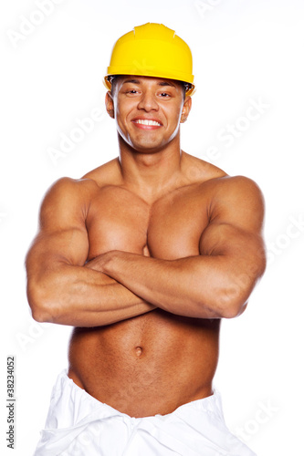 Image of young handsome builder posing