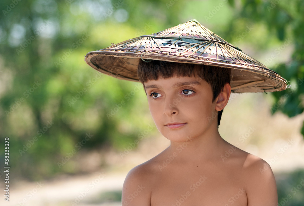 Boy In Vietnamese Hat Is Looking Sideways Stock Photo Adobe Stock Boy In Vietnamese Hat Is Looking Sideways Stock Photo Adobe Stock