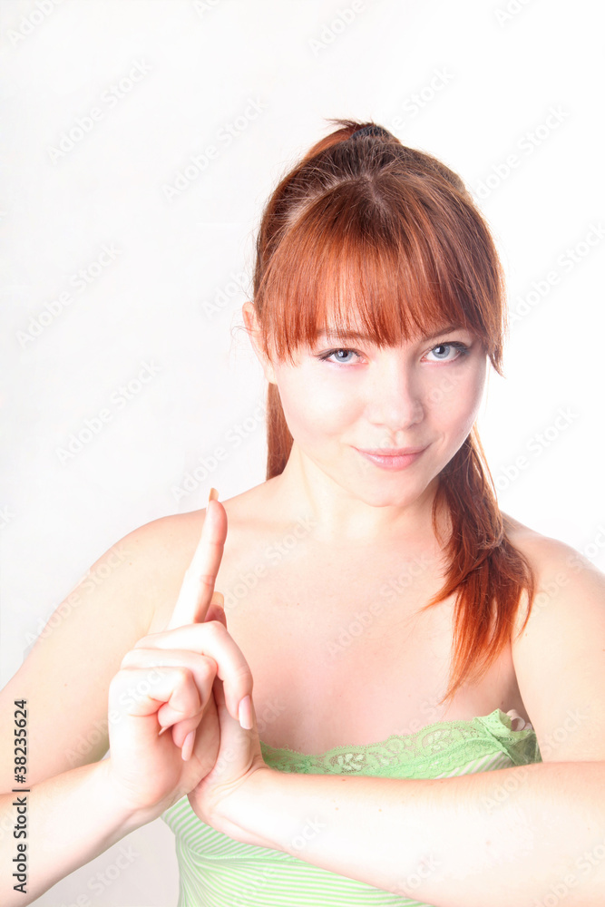 Sensual young smiling woman with beautiful long red hair
