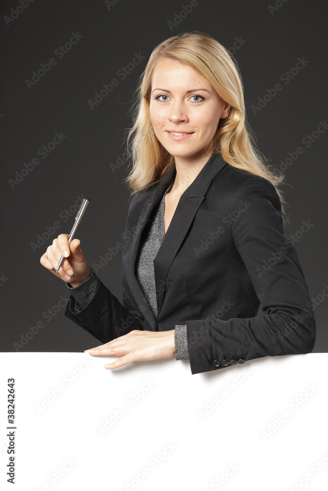 Woman standing behind and leaning on white board Woman standing behind and leaning on white board
