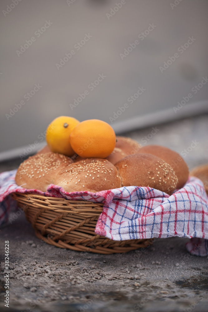 woven wicker plate with fruit and bread