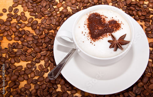 Frothed coffee with heart shape and star aneceed photo