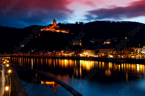 illuminated city and castle close to river © Olha Rohulya