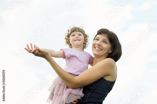 Portrait of mother with daughter outdoor