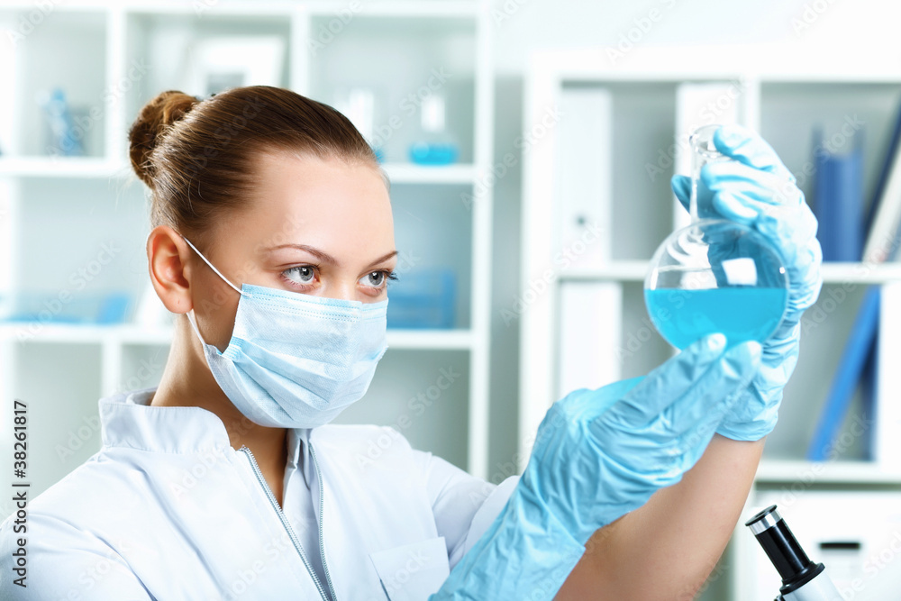 Young scientist working in laboratory Young scientist working in laboratory