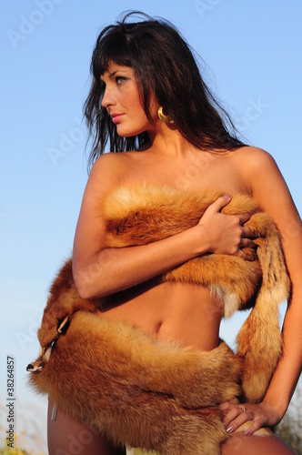 brunet nude woman in fur.