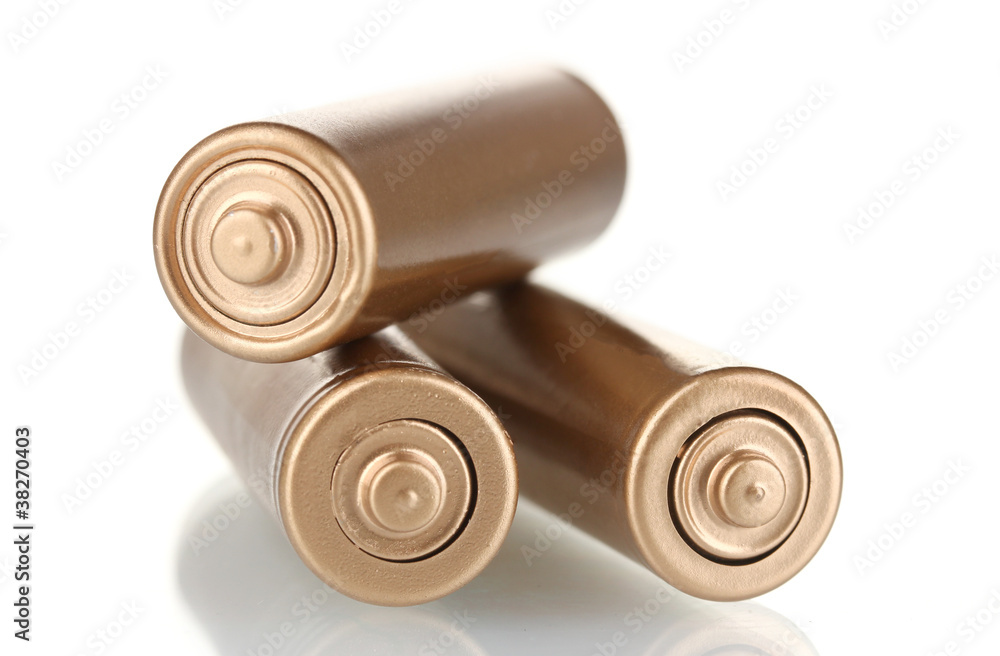 three golden batteries isolated on white three golden batteries isolated on white