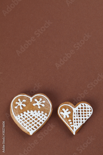 Gingerbread hearts on brown background