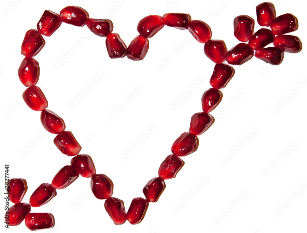 Love symbol pierced with arrow made of pomegranate seeds Love symbol pierced with arrow made of pomegranate seeds