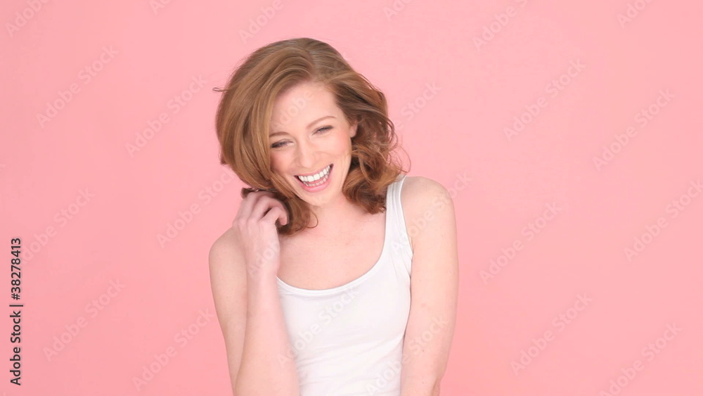 Laughing Woman Giving Thumbs Up sign signifying approval Laughing Woman Giving Thumbs Up sign signifying approval