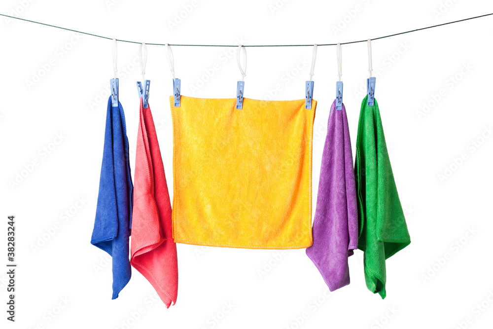 Row of colorful microfiber towels hanging on a rope