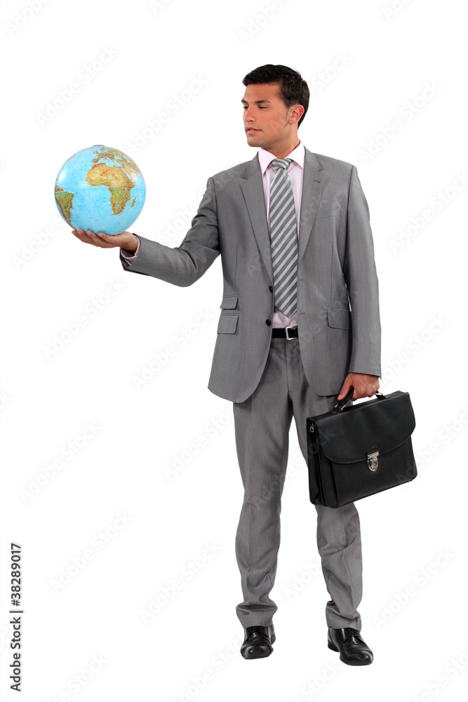 Businessman holding globe Businessman holding globe