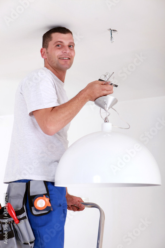 Man fitting light
