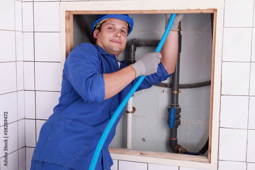 Electrician wiring a bathroom Electrician wiring a bathroom