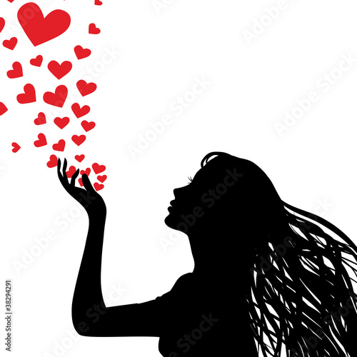 Silhouette woman blowing heart