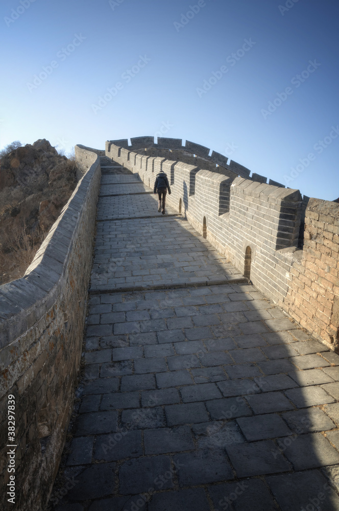 Beautiful girl standing on the Great Wall of China - Simatai