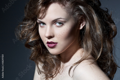 Closeup portrait of a sexy young caucasian woman with red lips