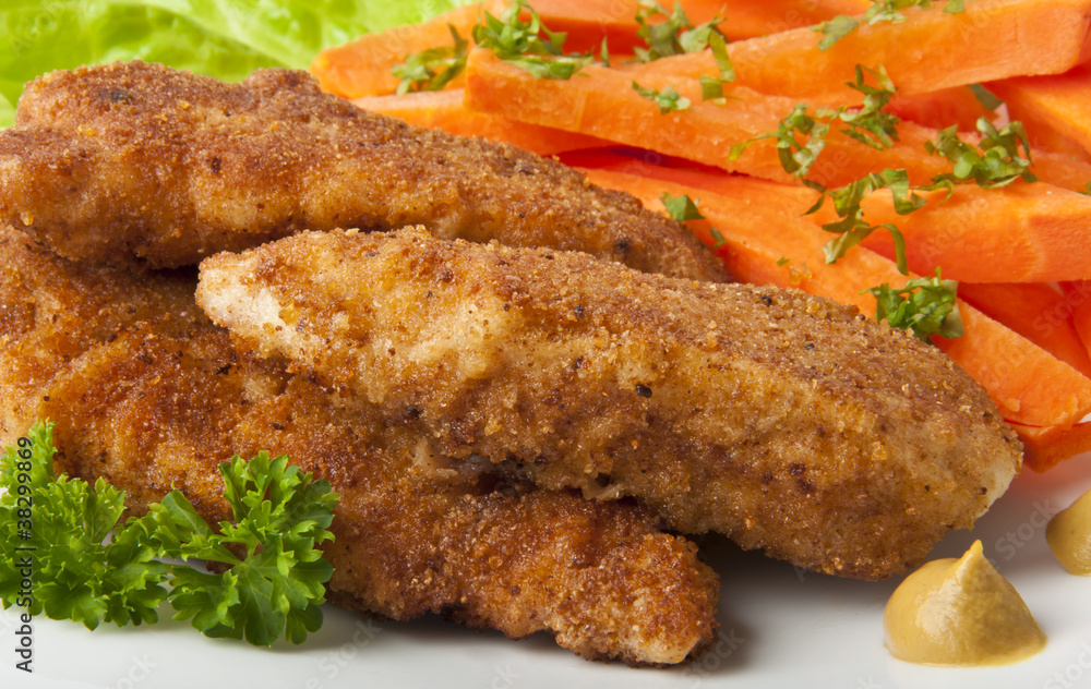 chicken fried in breadcrumbs with vegetables